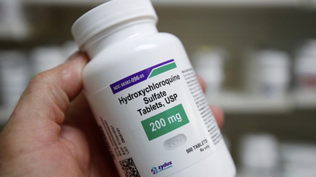 A pharmacy tech holds a bottle of Hydroxychloroquine at Rock Canyon Pharmacy in Provo, Utah, on May 20, 2020
