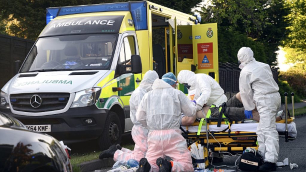 Ambulance and air ambulance crews work to stabilise a patient with possible COVID-19 symptoms who was found unconscious having suffered a cardiac arrest while cycling in Botley on May 06, 2020 near Southampton, England.