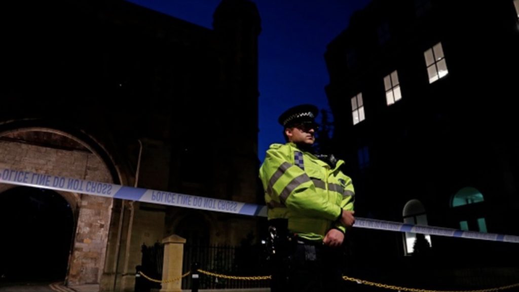 Police officers secure a police cordon at the Abbey Gateway near Forbury Gardens park in Reading, west of London, on June 20, 2020 following a stabbing incident.