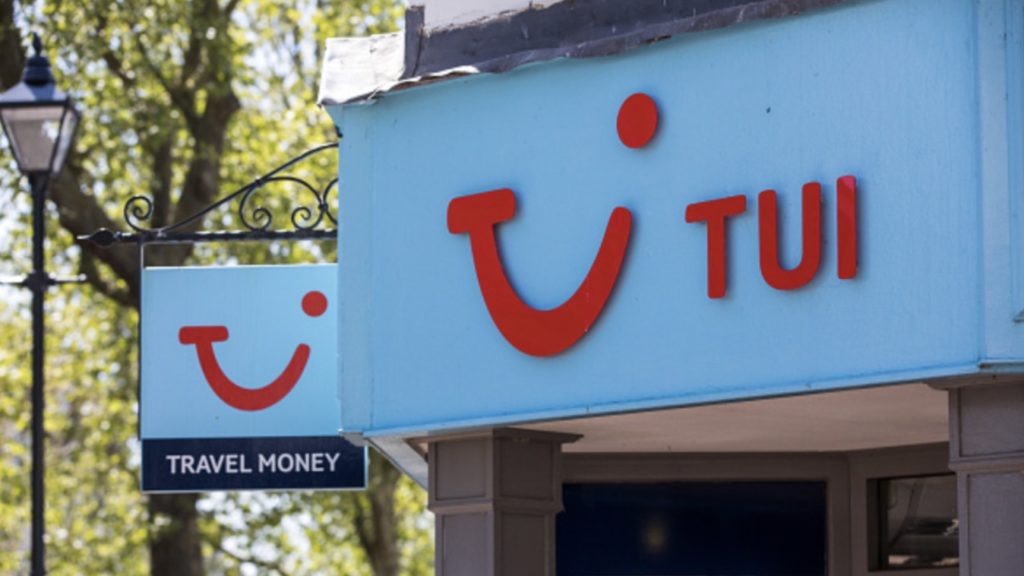 A sign hangs above the entrance to a closed travel agency store, operated by Tui AG, in Ashford, U.K., on Wednesday, May 6, 2020