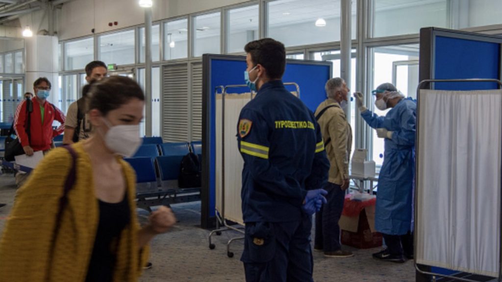 Medical staff conduct a test for the new coronavirus on the passengers who arrived from Rome to Eleftherios Venizelos International Airport on June 15, 2020 in Athens, Greece.